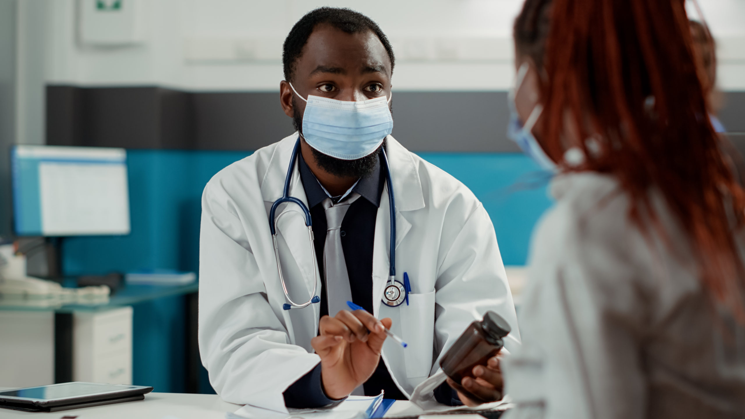 Black doctor with black patient